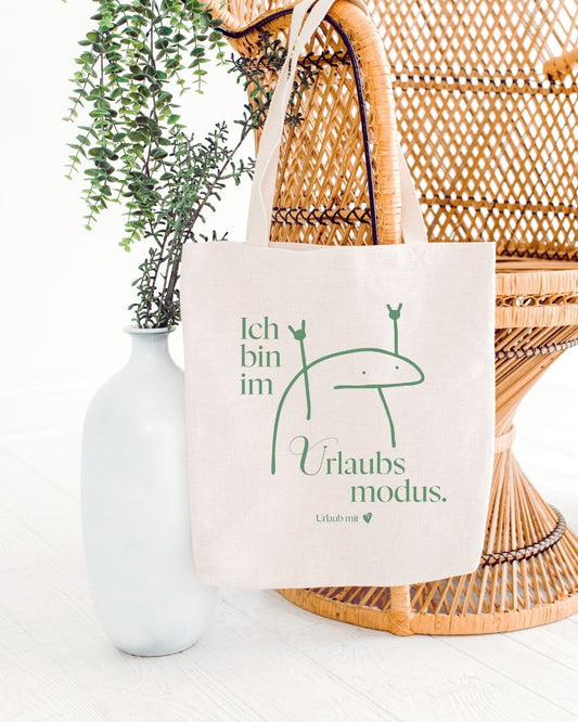 Baumwolltasche mit der Aufschrift „Ich bin im Urlaubsmodus" – ein schönes Gastgeschenk für Ferienwohnungen